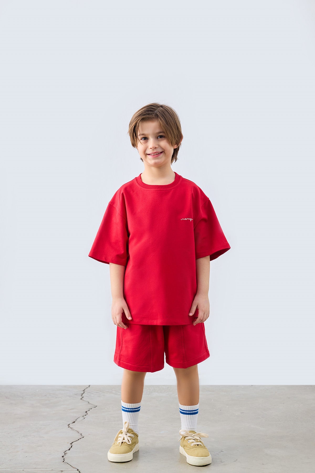 Red bermuda shorts for kids from Lunette's Sweet & Salty SS26 collection, Kuwait